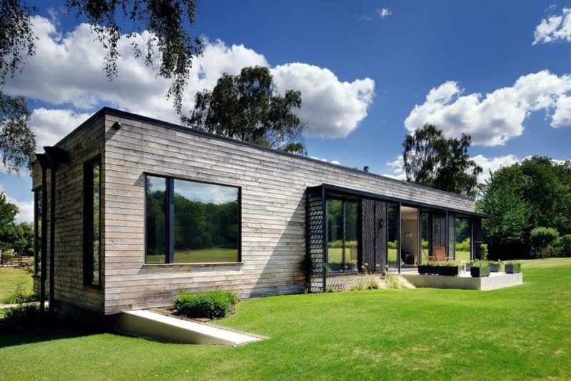 Modular Home with Horizontal Wood Siding and Rectangular Form.