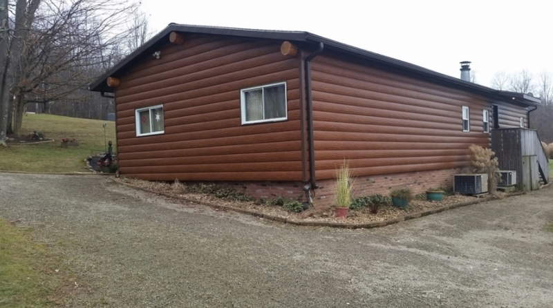 Modular House with Log Look Siding and Brick Skirting