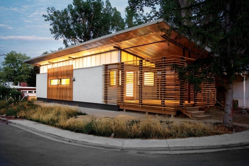 Modular Structure with Horizontal Slat Screen and Wide Overhang Roof.