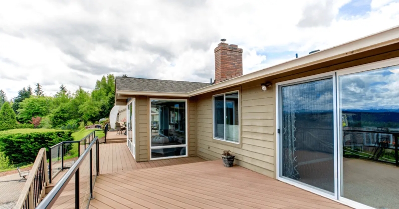 Multi-Level Deck with Black Metal and Glass Panel Railing