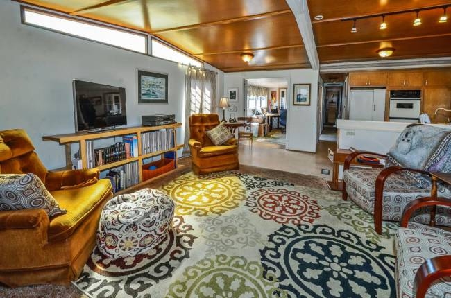 Mustard Yellow Chairs and Medallion Rug in Mid-Century Living Room