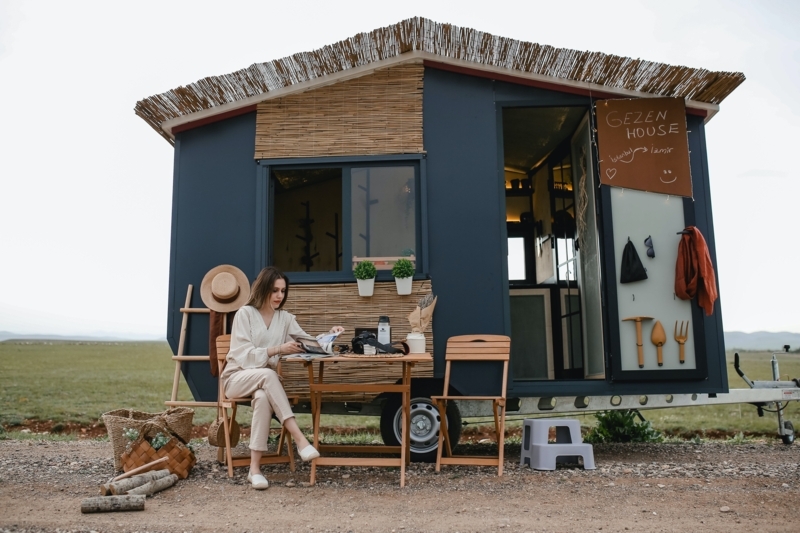 Navy Tiny House with Rustic Thatched Roof and Reed Siding