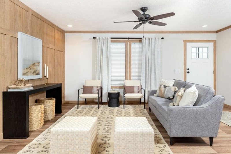 Neutral Living Room with Wood Paneling and Woven Accents