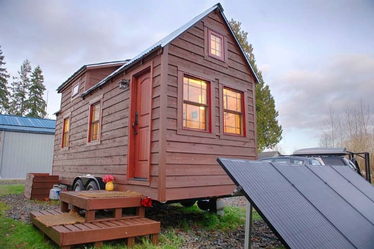 Off-Grid Tiny House with Solar Array and Red Trim