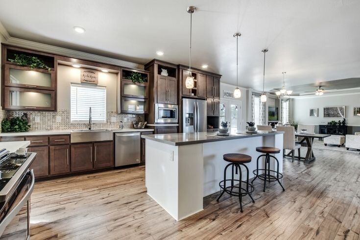 Open Concept Kitchen with Dark Wood Cabinets and Contrasting White Island