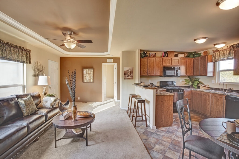 Open Concept Layout: Wood Cabinets and Breakfast Bar