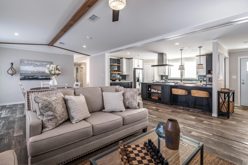 Open Concept Living Room: Exposed Wood Beams & Dark Kitchen Island