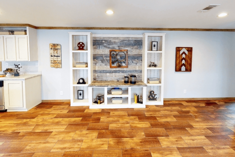 Open Concept Living Room with Wood Plank Accent Wall and Built-Ins
