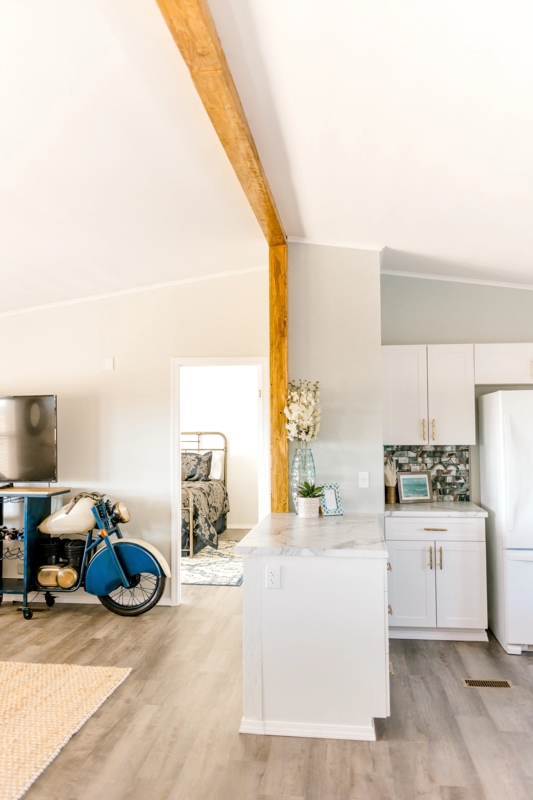 Open Concept Mobile Home Remodel with Exposed Wood Beam