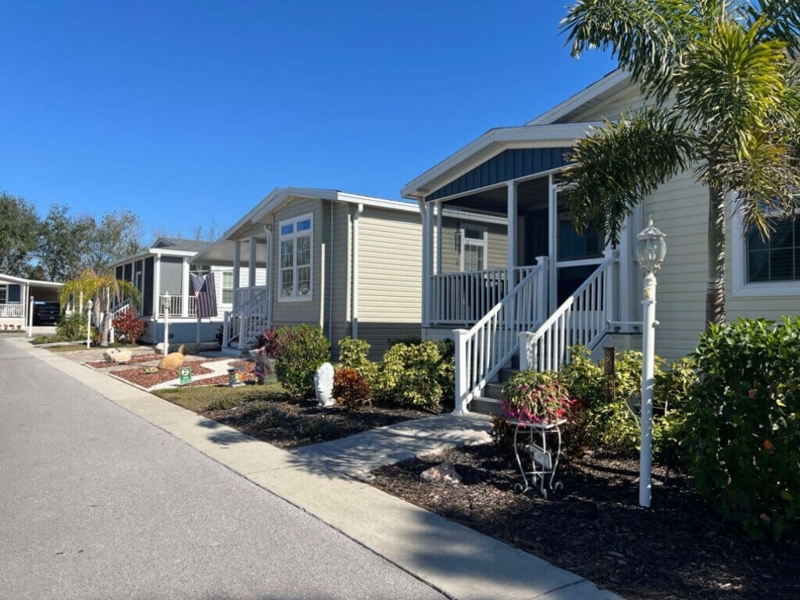Orderly Row of Manufactured Homes with Screened Porches