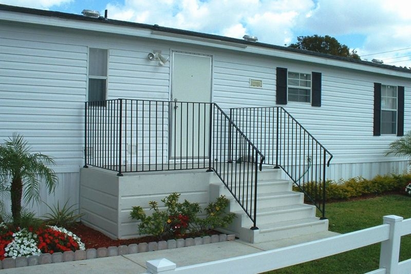 Outdoor Steps, Entrance Platform with Black Metal Railing.