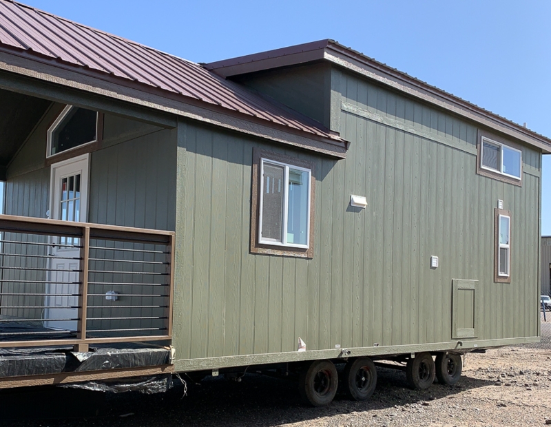 Park Model Home Exterior: Olive Green Siding and Brown Metal Roof