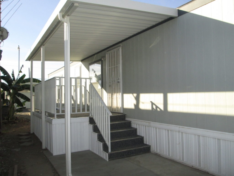 Patio Cover Metal Design with Integrated Gutters and Matching Railing