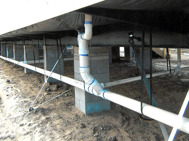 Plumbing Pipes with Suspended Support System in Mobile Home Crawlspace