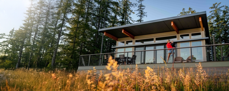 Prefab Home with Deck: Deep Roof Overhang, Exposed Beams