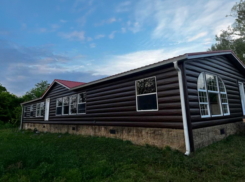 Ranch House Exterior: Log Profile Siding, Red Metal Roof