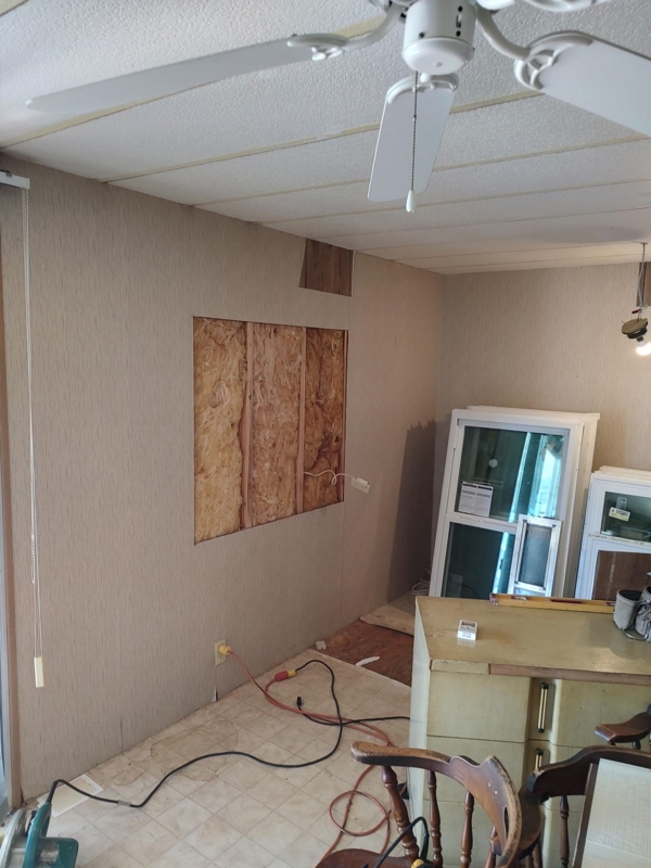 Renovation Site: Manufactured Home with Exposed Fiberglass Insulation