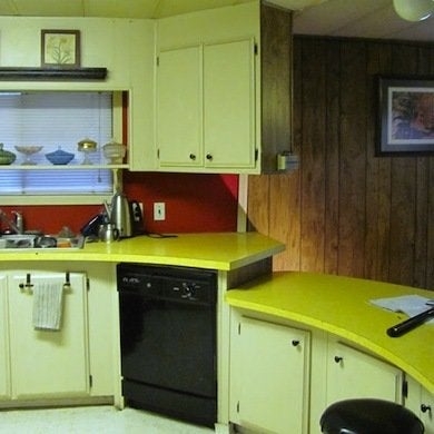 Retro Kitchen with Yellow Countertops and Red Backsplash