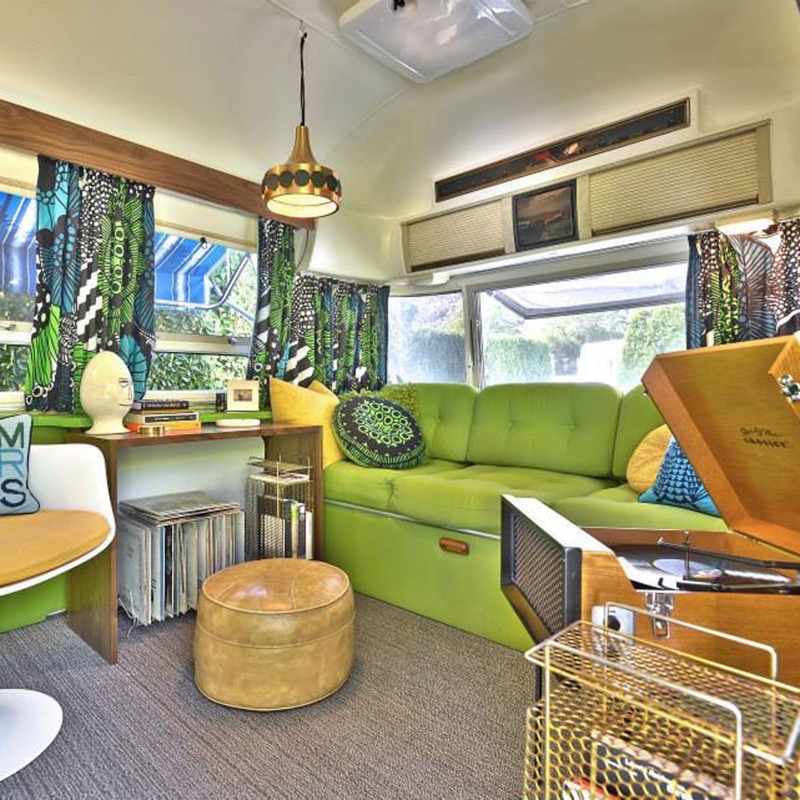 Retro Trailer Lounge with Lime Green Sectional and Graphic Curtains