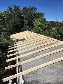 Roof Rafters Installation Showing Notched Wood Parallel Beams