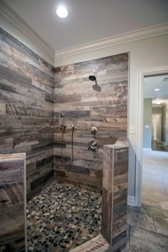 Rustic Bathroom: Walk-In Shower with Wood Look Tile and Pebble Floor