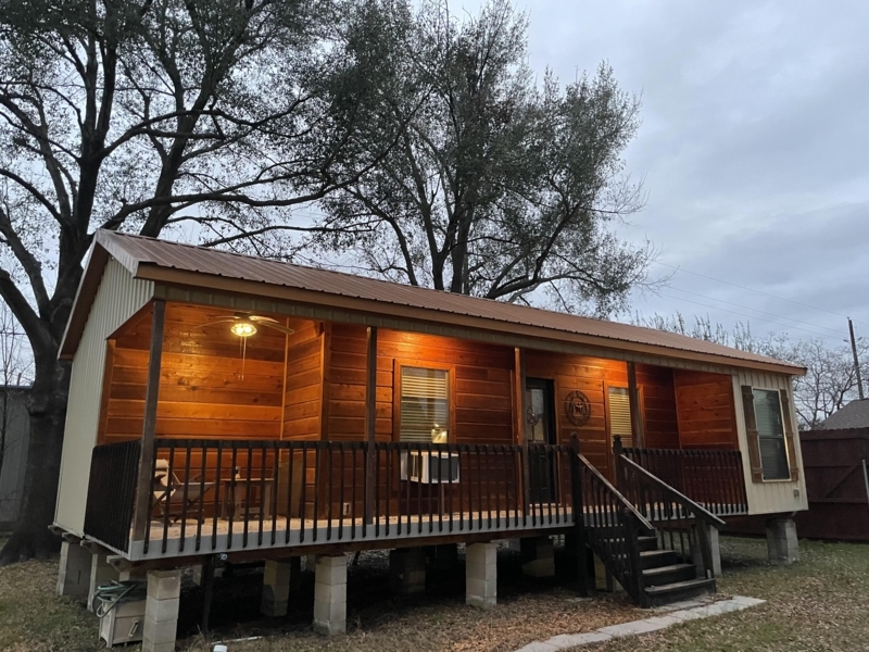 Rustic Cabin Elevated Foundation with Covered Wood Siding Porch Design