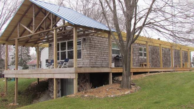 Rustic Cabin Mobile Home: Cedar Shake Siding & Timber Frame Gable