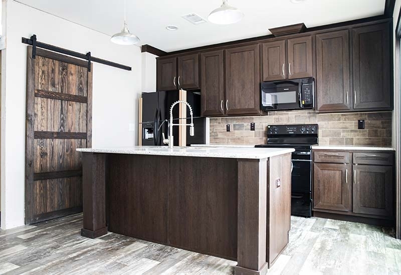 Rustic Kitchen with Dark Espresso Cabinets and Z-Brace Barn Door