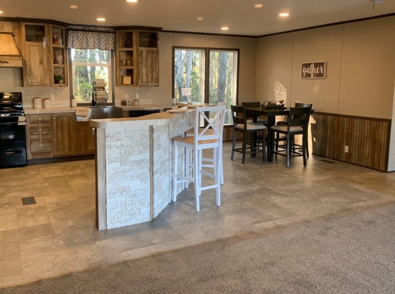 Rustic Kitchen with Stacked Stone Breakfast Bar and Wood Wainscoting