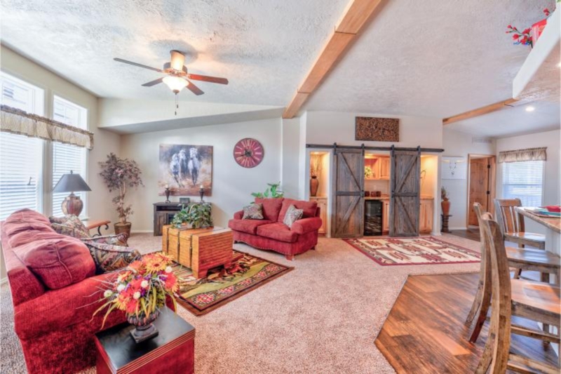 Rustic Living Room with Red Upholstery and Sliding Barn Doors