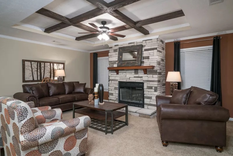 Rustic Living Room with Wood Beams and Stone Fireplace