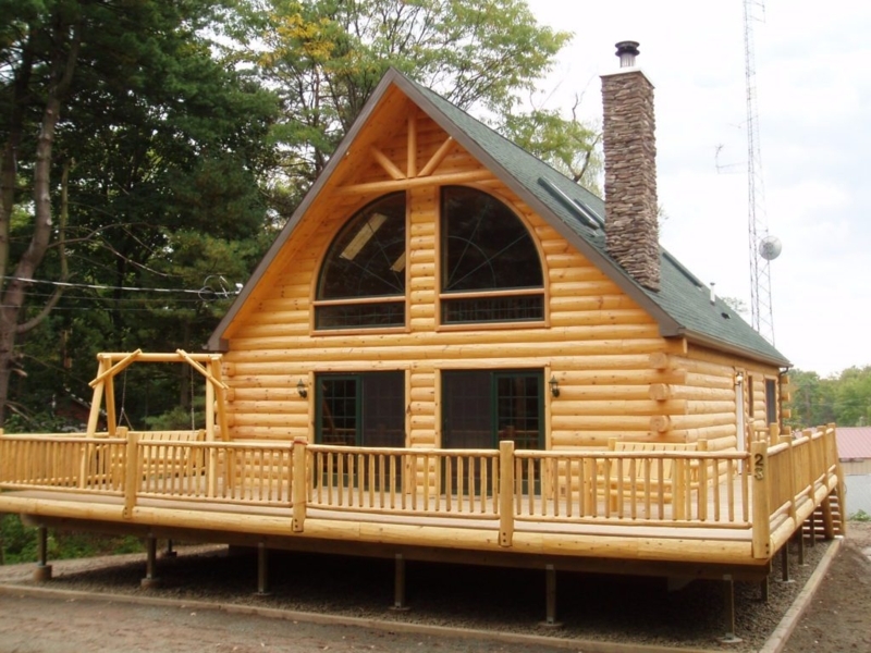Rustic Log Cabin with Arched Windows and Stone Chimney