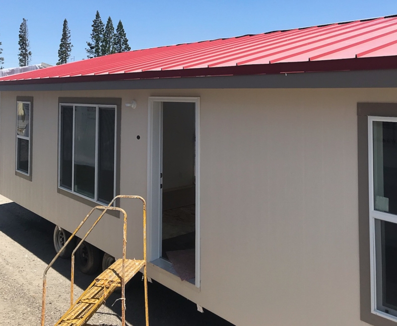 Rustic Red Corrugated Metal Roof on Beige Manufactured Home