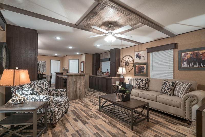 Rustic Southwestern Living Room with Antler Lamp and Decorative Beams