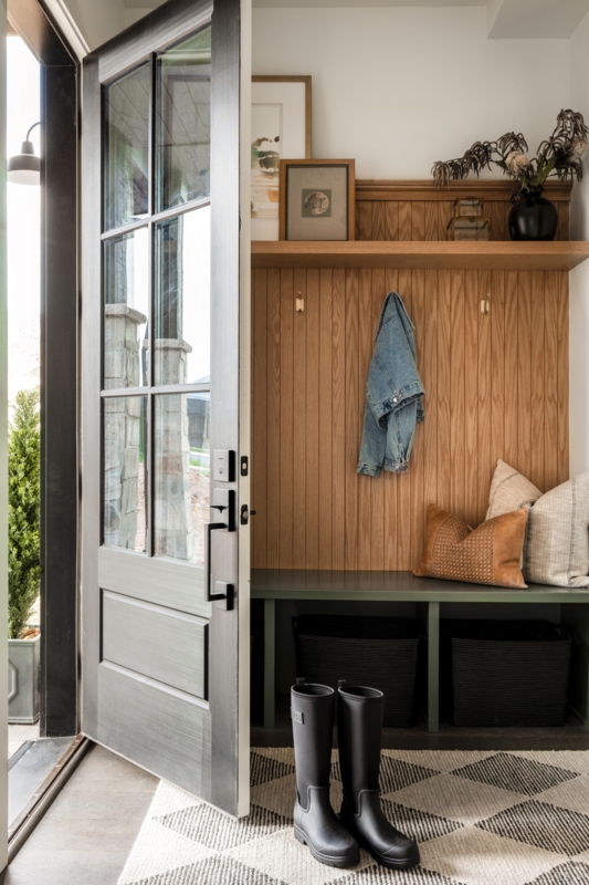 Sage Green Entryway Bench: Vertical Wood Slats, Cubbies, & Geometric Rug