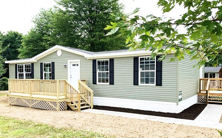 Sage Green Manufactured Home Exterior with Large Natural Wood Deck