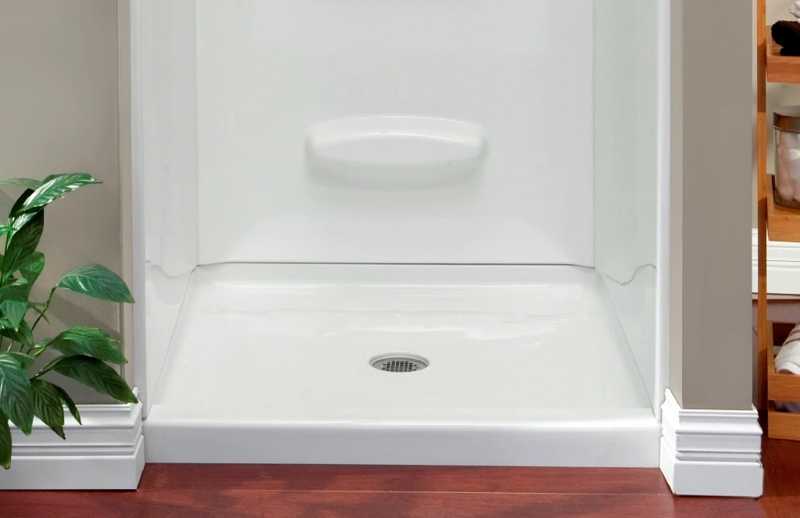 Shower Stall with Integrated Soap Shelf and Low Profile Curb Design.