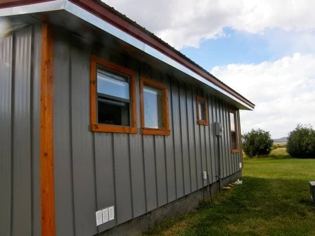 Siding: Vertical Steel Panels with Wood Toned Frames