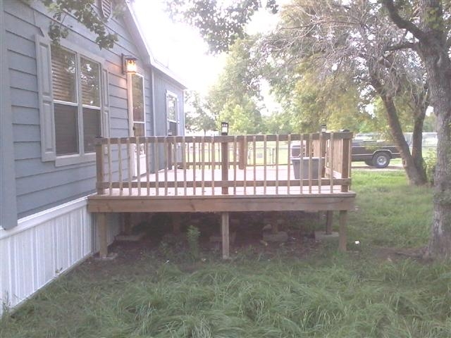 Simple Wooden Deck with Vertical Slat Railing for Manufactured Homes