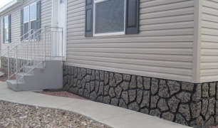 Simulated Rock Skirting with Charcoal Grout Lines for Manufactured Homes