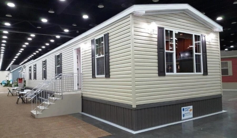 Single Wide Mobile Home Exterior with Beige Vinyl Siding and Shutters
