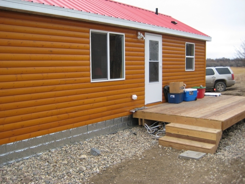 Skirting Panels: Galvanized Finish for Rustic Cabin Foundation