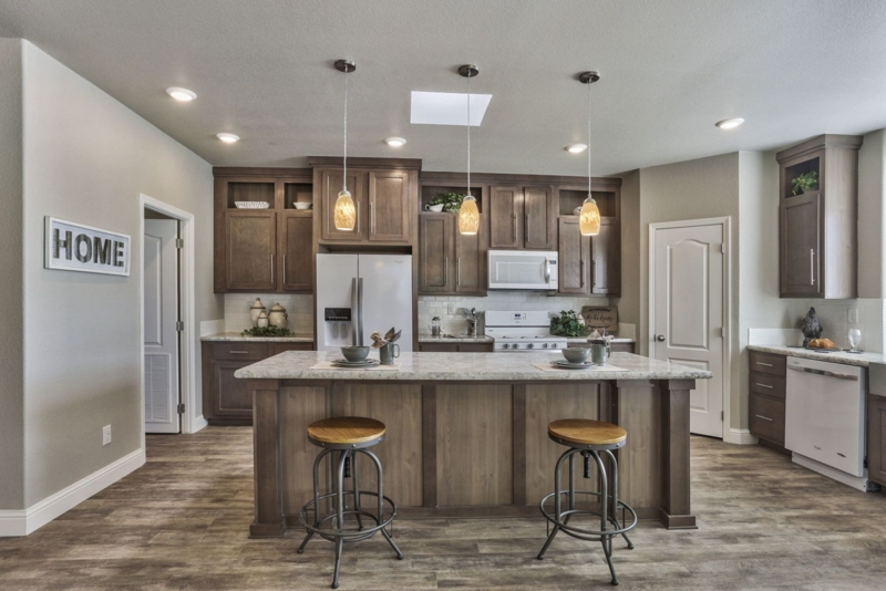 Skylit Kitchen Wood Cabinets Amber Pendants Transitional Style Island
