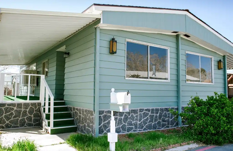 Slate Gray Stone Look Skirting for Sage Green Manufactured Home Exterior