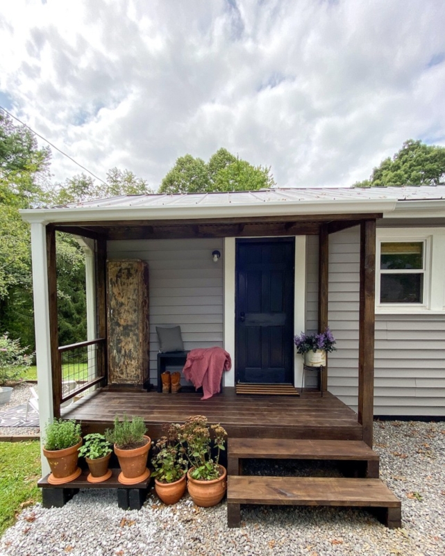 Small Back Porch with Dark Wood Deck & Distressed Cabinet