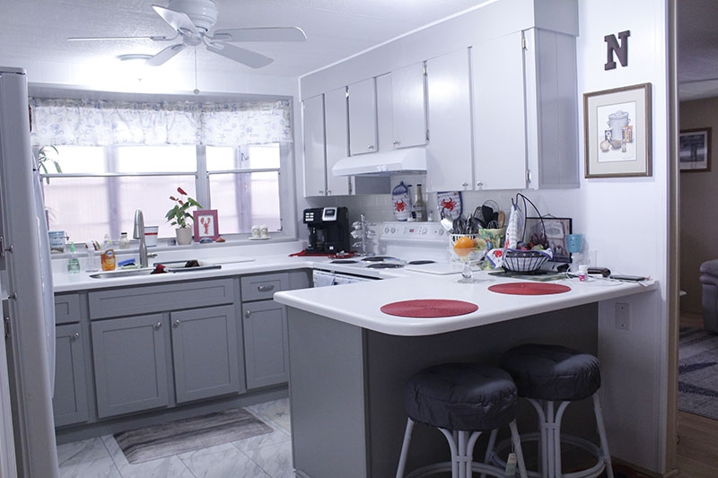 Small Kitchen Peninsula with Breakfast Bar Seating & Two-Toned Cabinets