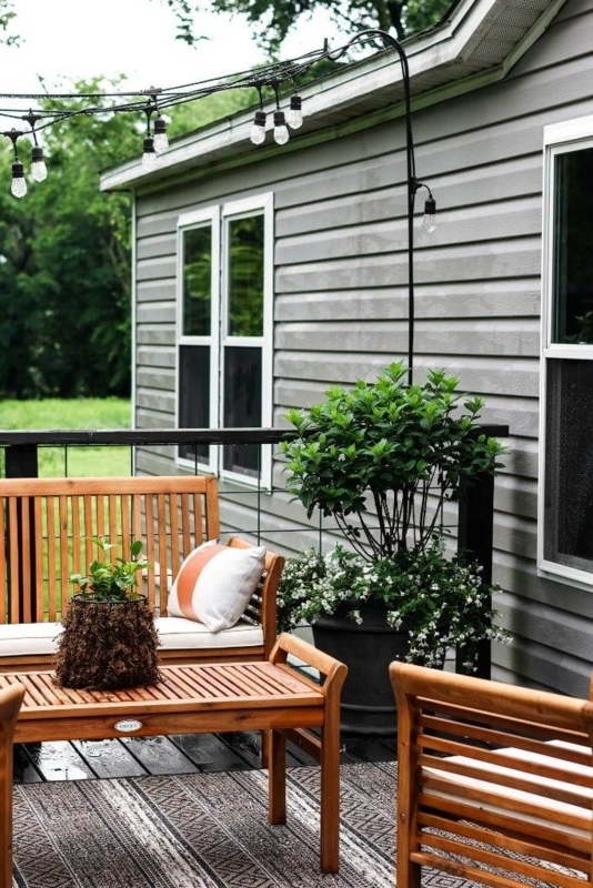Small Porch Makeover with Slatted Furniture and String Lights