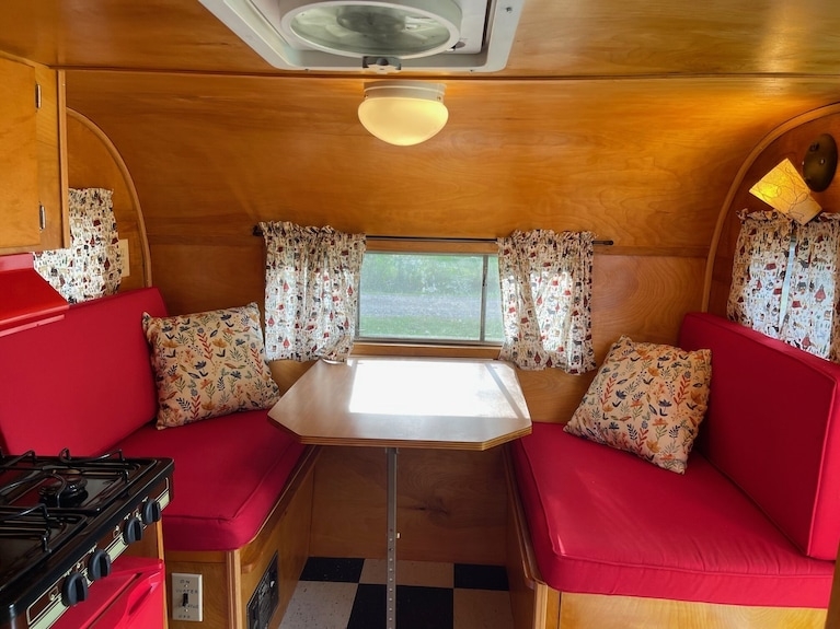 Small Space Dinette Seating with Red Upholstery and Checkered Floor
