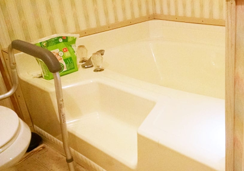 Soaking Tub with Grab Bar and Built-In Surround