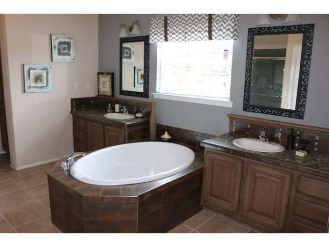 Soaking Tub with Split Double Vanity Layout and Chevron Valance